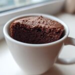 A rich, dark chocolate Cottage Cheese Microwave Brownie baked and served directly in a white mug.