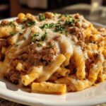 Close-up of Cheesy Ground Beef Pasta Skillet with melted mozzarella and fresh parsley garnish.