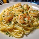 Close-up of Creamy Lemon Garlic Shrimp Pasta tossed in a rich sauce and topped with seasoned shrimp and fresh parsley.
