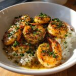 Close-up of a Garlic Butter Shrimp Bowl with Rice, featuring succulent shrimp coated in garlic butter sauce and parsley.