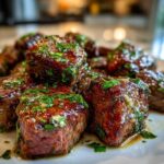 Close-up of tender Garlic Butter Steak Bites coated in glossy sauce and fresh parsley.