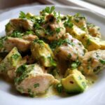 Close-up of creamy avocado chicken pieces garnished with fresh parsley, a perfect Quick Low-Carb Dinner.