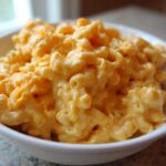 Close-up of creamy, cheesy Chick-fil-A Mac and Cheese served in a small white bowl.