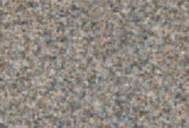 Abstract, grainy background texture, possibly representing a countertop or surface near the Strawberry Shortcake.
